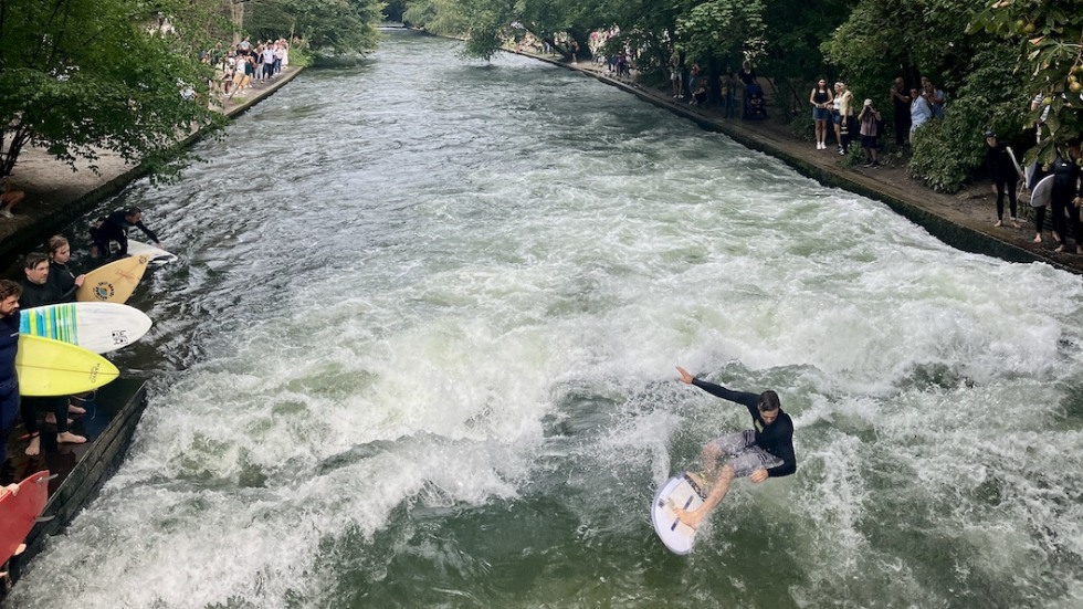 Watching surfers at the Eisbachwelle, Englischer Garten, Munich